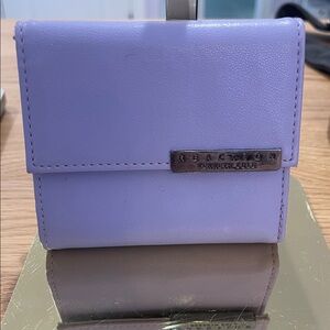 Kenneth Cole Reaction lavender compact bifold wallet with metal logo plate